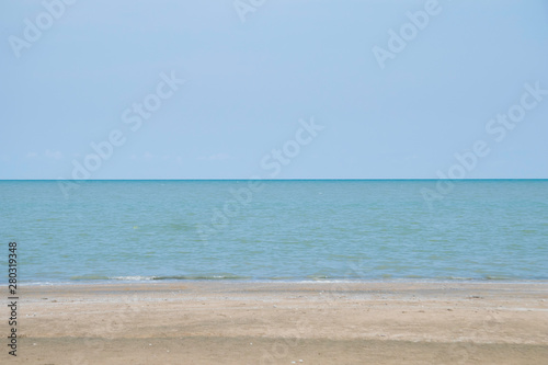 Beautiful sea beach with sun light reflection and bubble foam of sea wave with copy space