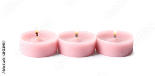 Pink wax decorative candles isolated on white