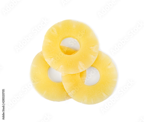 Slices of delicious sweet canned pineapple on white background, top view