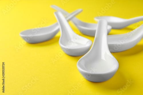Clean Miso soup spoons on yellow background