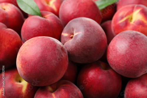 Delicious ripe sweet peaches as background  closeup