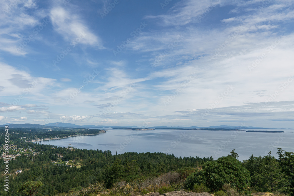 Aerial panoramic view of the city of Victoria from mount Douglas park with a beautiful Pacific Ocean scene. Aerial panoramic view of the city of Victoria from mount Douglas park with a beautiful Pacific Ocean scene.