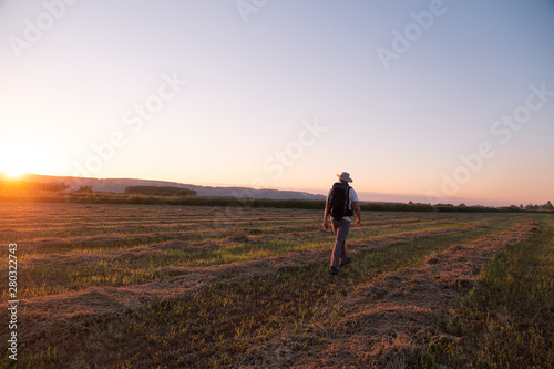 backpacker traveler walking at sunrise