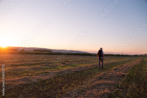 backpacker traveler walking at sunrise