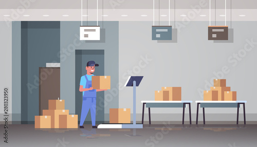 courier man in uniform putting parcel box on scales mail express delivery logistic service concept modern warehouse interior flat horizontal full length