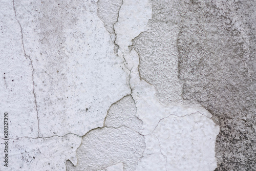 The cement walls painted white. From time to time, for many years. And there is a disconnection occurs, cracks.