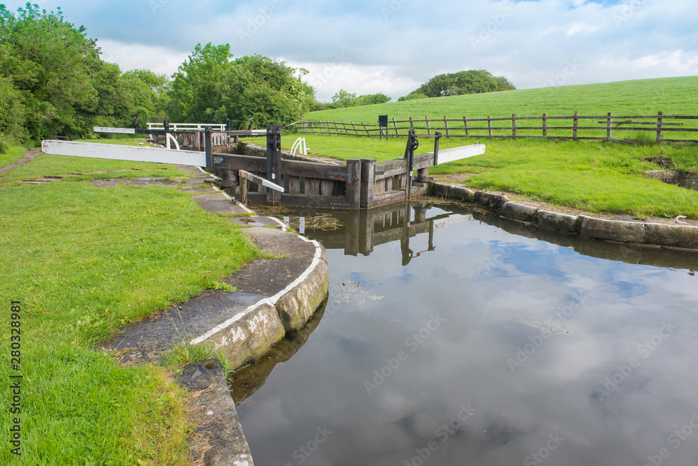 Fototapeta premium View of a British canal lock in rural setting