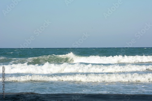 waves breaking on the beach