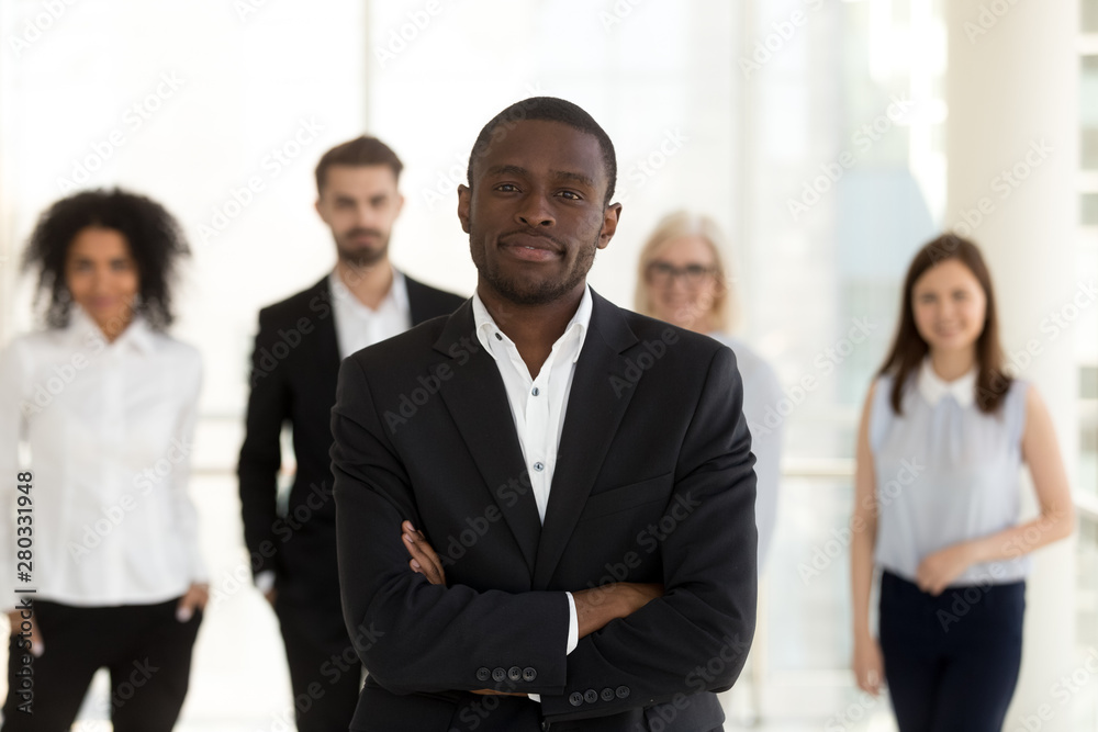 African American leader, boss with employees team look at camera African American leader, boss with employees team look at camera