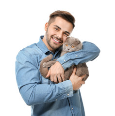 Young man with cute funny cat on white background