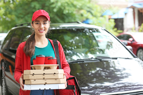 Female worker of food deliv...