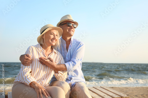 Happy mature couple at sea resort © Pixel-Shot