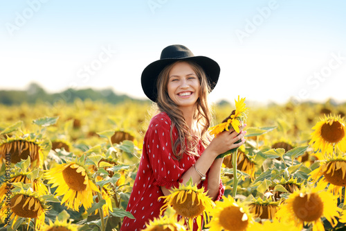 Beautiful young woman in su...