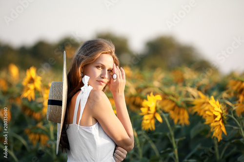 Beautiful young woman in su...