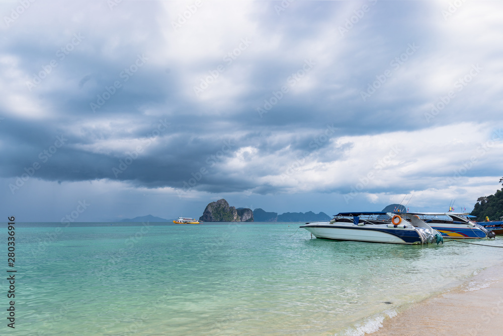 A rain storm is coming. Two ships in the Andaman Sea. Krabi, southern Thailand