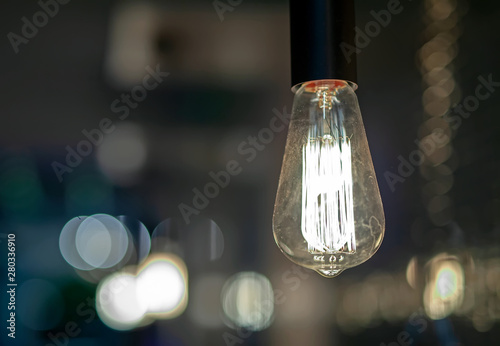 Incandescent lamp in retro style, on the wire.