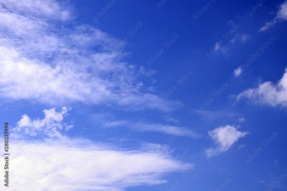 White clouds on blue sky background,use for backdrop or web design,soft focus.