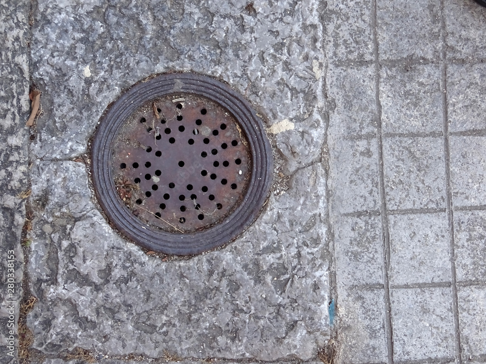  Old water drainage system on old stone street