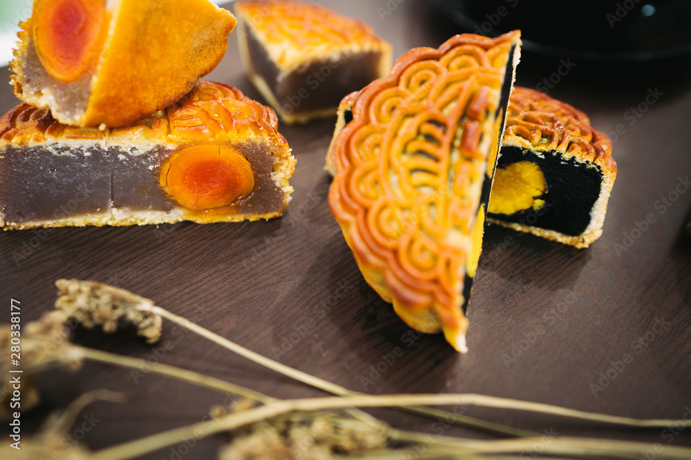 Beautiful Moon cakes and teacup on wooden table. Mid autumn festival ...