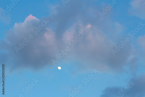 beautiful evening with moon on blue sky