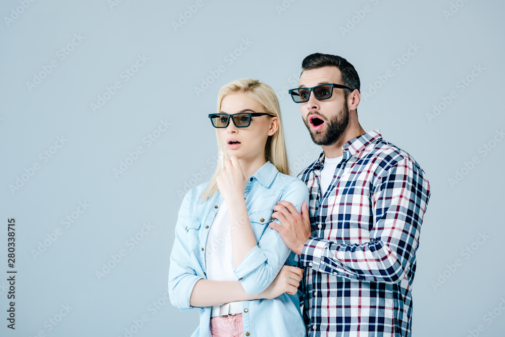 shocked man and girl in 3d glasses watching movie isolated on grey shocked man and girl in 3d glasses watching movie isolated on grey