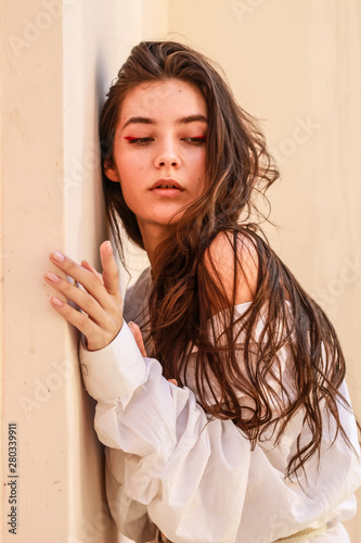 Young beautiful lady wearing a stylish white shirt.Portrait shooting of a stylish girl.Trends summer 2019. photo