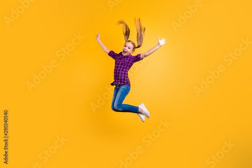 Full size side photo of small pupil jump high hooray holidays wear casual checkered shirt jeans denim isolated yellow background