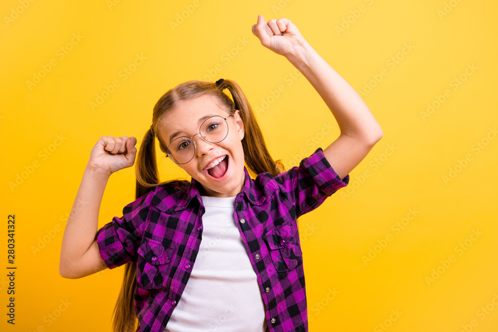 Closeup photo of little lady amazed best pupil excellent grade test wear specs checkered shirt isolated bright yellow background Closeup photo of little lady amazed best pupil excellent grade test wear specs checkered shirt isolated bright yellow background