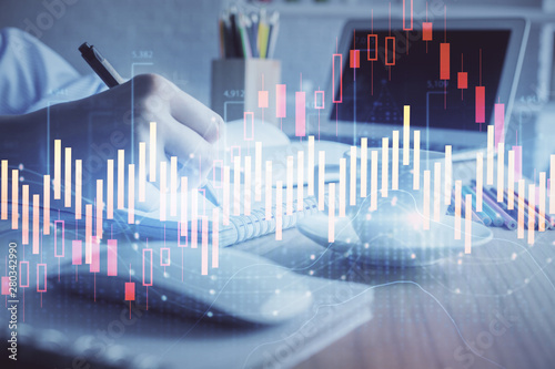 Financial chart drawn over hands taking notes background. Concept of research. Double exposure © peshkova