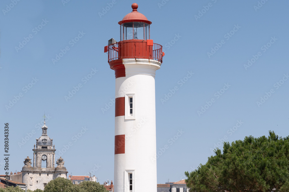 La Rochelle white and red lighthouse on sunny day in southwest france