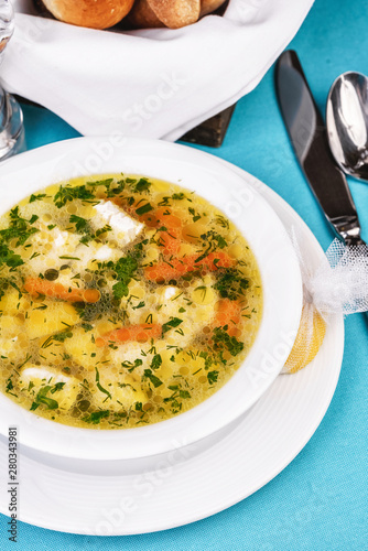 Mediterranean recipe for chicken, vegetables and seafood on a blue background