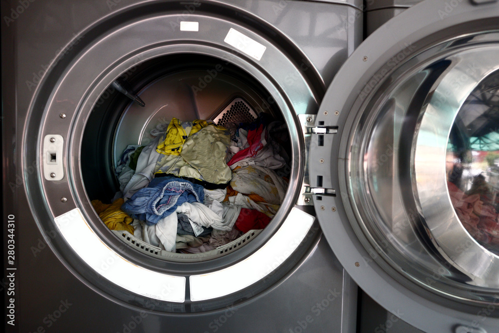 Washed clothes inside a spin dryer