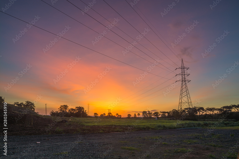 Electric Tower with Cable against Twilight Sky