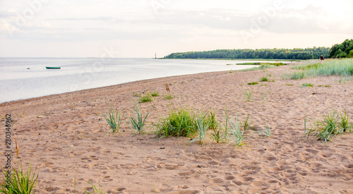 Sandy beach and sunset at the bay photo