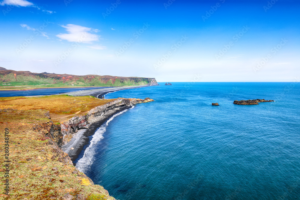 View of Kirkjufjara black sand beach from Dyrholaey promontory