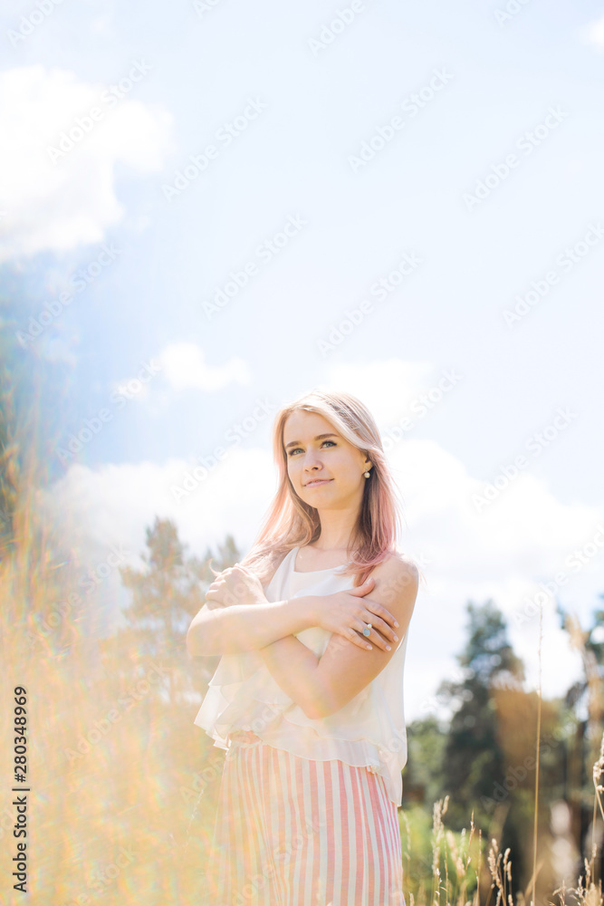 beautiful girl with pink hair against the blue sky beautiful girl with pink hair against the blue sky