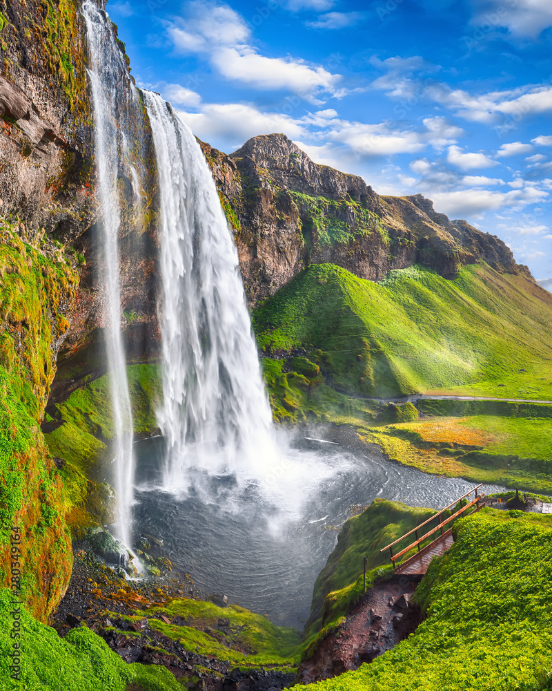 Fantastic Seljalandsfoss waterfall in Iceland during sunny day. - obrazy, fototapety, plakaty 