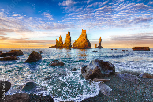 Incredible view of  rock formations Troll Toes on Black beach Reynisfjara near the village of Vik. photo