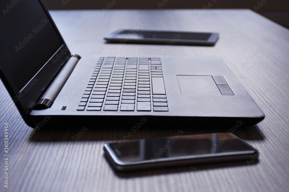 Laptop, digital tablet and smart phone on the desk Laptop, digital tablet and smart phone on the desk