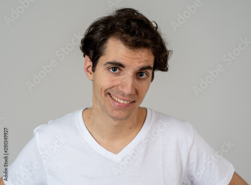 Portrait of young handsome cheerful man with smiling happy face. Human expressions and emotions