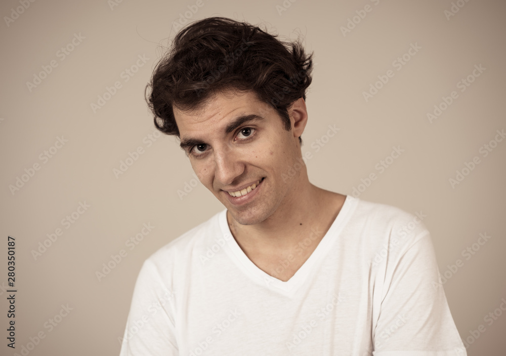 Portrait of young handsome cheerful man with smiling happy face. Human expressions and emotions Portrait of young handsome cheerful man with smiling happy face. Human expressions and emotions