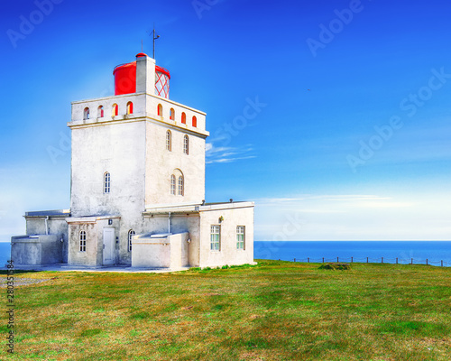 Landscape with white lighthouse at Cape Dyrholaey