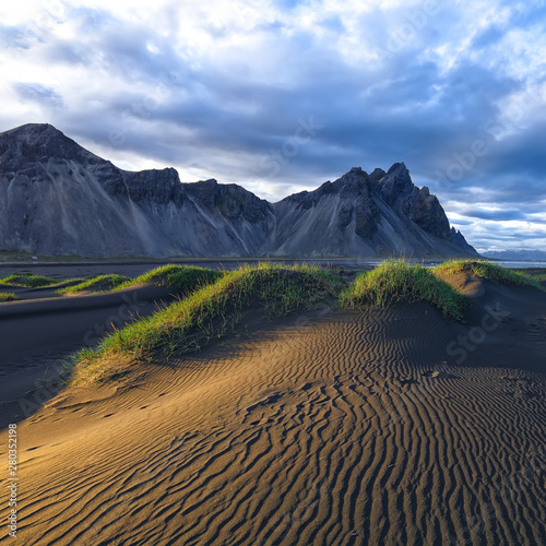 Fantastic sunny day and gorgeous black sand dunes on Stokksnes cape in Iceland.