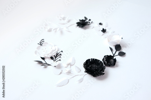 Black and white paper flowers on white background. Cut from paper.