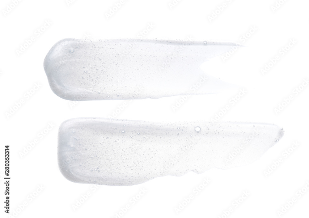Pearly white smears and texture of face cream or acrylic paint isolated on white background