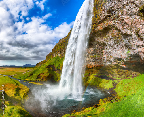Fantastic Seljalandsfoss waterfall in Iceland during sunny day.