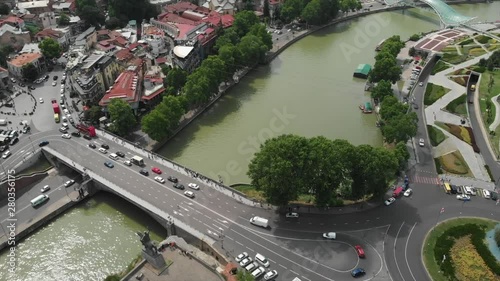 Aerial video of the Old Tbilisi center from above. Drone top view of historical part of city Dzveli Tbilisi. Kura or Mtkvari river below.