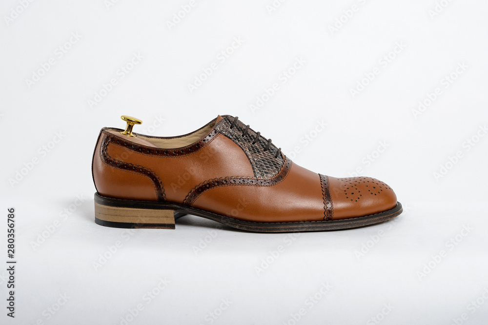 Classic male leather shoes. Isolated on white background. Side view Classic male leather shoes. Isolated on white background. Side view