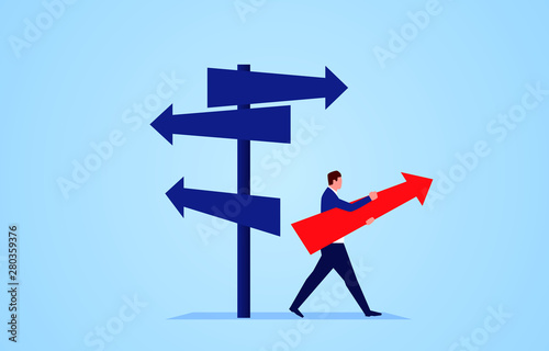 Businessman standing in the direction of the crossroads chose the direction