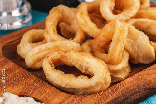 European cuisine, Mediterranean dish. Squid rings fried in batter snack for beer with cream sauce and steamed rice
